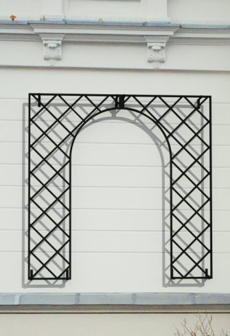 Classic Garden Elements' Treillage Metal Wall Trellis installed on a white wall, Gate Trellis