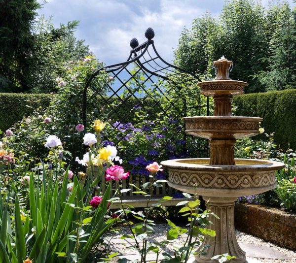 The Victorian Rose Arbour by Classic Garden Elements with bench and fountain in a private garden in Austria