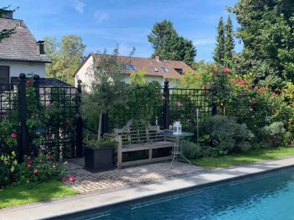 Bauhaus Metal Railing Panels by Classic Garden Elements enclosing pool area