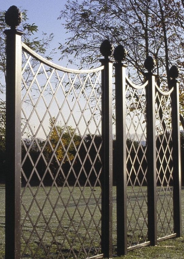 Close-up of Paravent Metal Railing Panels with pine-cone finials