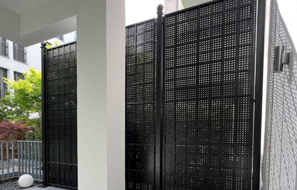 The Gropius Iron Railing Privacy Screen by Classic Garden Elements providing a secluded space on a balcony