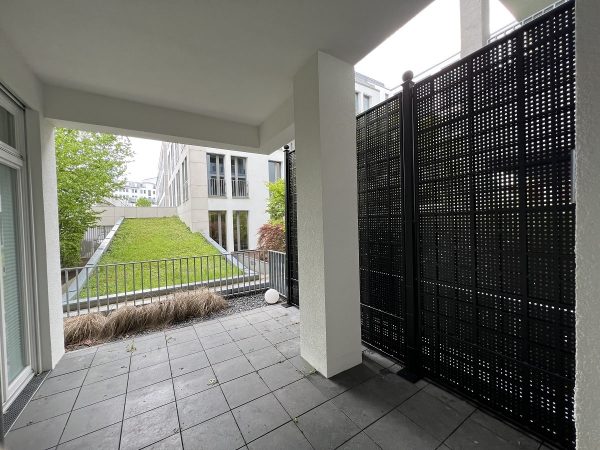 Classic Garden Elements' Gropius Iron Railing Privacy Screen creates privacy on a terrace