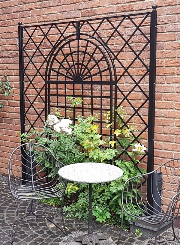 The Orangery Wrought-Iron Railing by Classic Garden Elements, custom-made for use in a courtyard garden