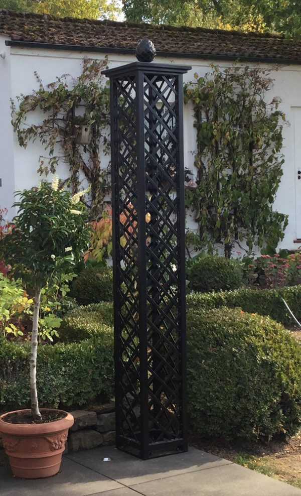 The Wessling Treillage Tower by Classic Garden Elements installed on a patio