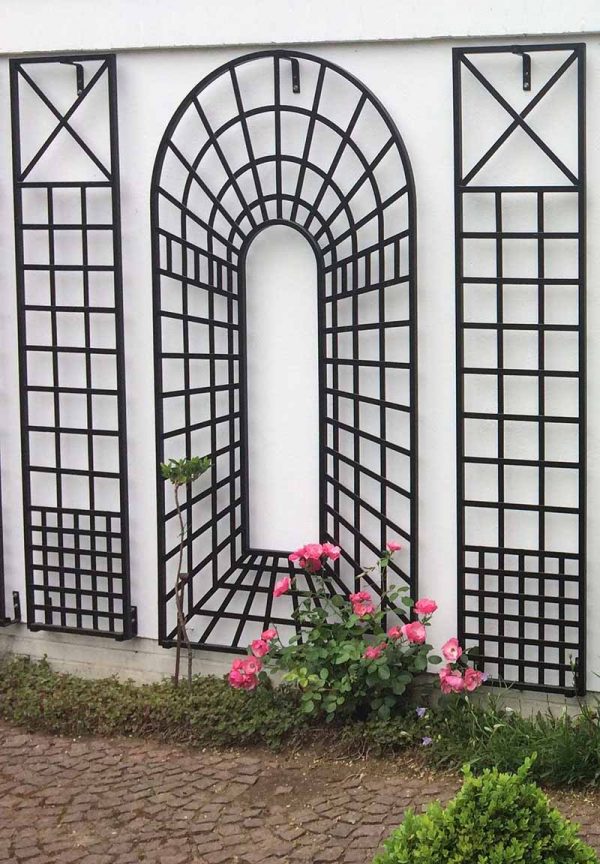 The Croome Treillage Panel Set by Classic Garden Elements with pink flowers