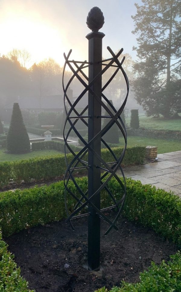 The Charleston Rose Obelisk by Classic Garden Elements, in the garden of an English castle