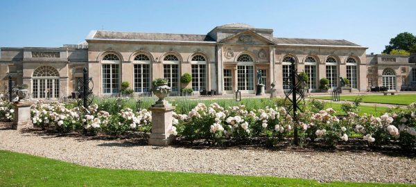 Several Classic Garden Elements Charleston Rose Obelisks in front of the Woburn Abbey Orangery