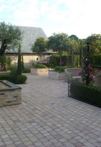 Elegant lawn edging by Classic Garden Elements giving structure to a patio