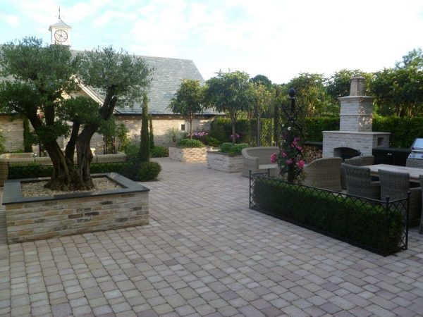 Elegant lawn edging by Classic Garden Elements giving structure to a patio