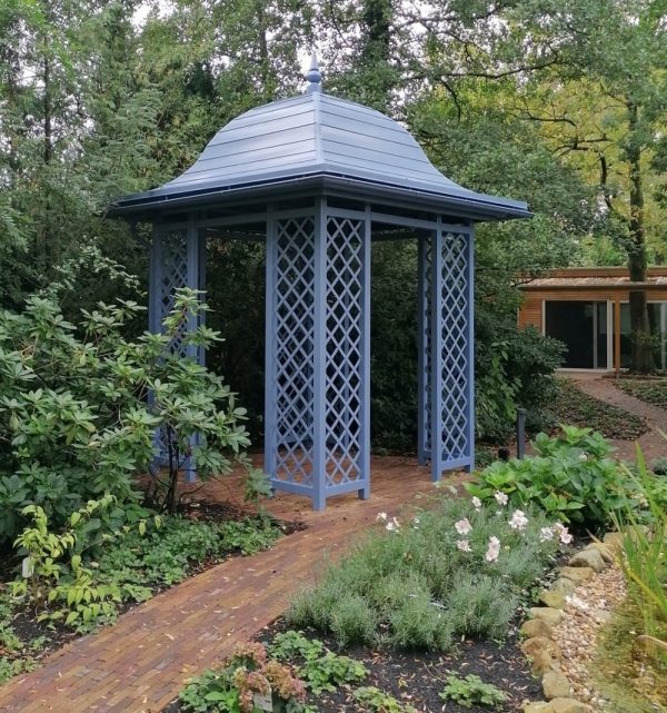 Classic Garden Elements' Wallingford Gazebo with full roof installed in a shady part of a garden