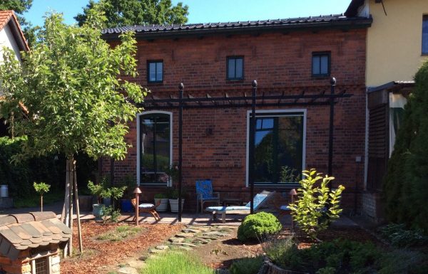 The Piemont Metal Pergola by Classic Garden Elements installed on a terrace