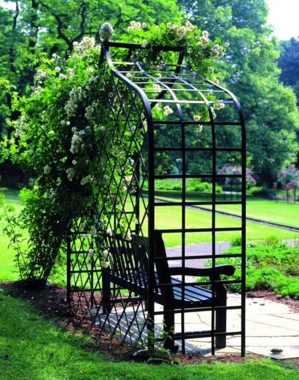 Side view of the Victorian Rose Arbour by Classic Garden Elements with a garden bench and rambler roses, at Westfalenpark, Dortmund