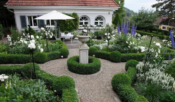 The Jules Gravereaux Garden Stakes providing support to 'Snow White' standard roses in the gardens designed by Götz Lauenstein in Würzburg