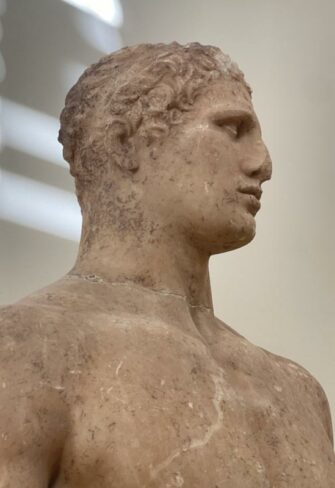 Delphic Statue of Agias – Frontal view of the full figure in a classical contrapposto pose