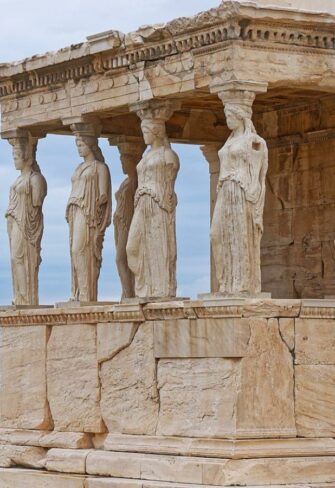 The majestic Porch of the Erechtheion on the Acropolis, featuring the renowned Caryatids. This architectural marvel combines beauty and history, offering a sublime statement piece for sophisticated architectural enthusiasts.