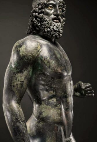 An impeccably preserved bronze statue of the Riace Warrior A, exhibiting stunning detail and ancient artistry. This rare piece captures the power and poise of classical antiquity, making it a prized addition to any exclusive collection.