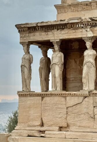Four beautifully preserved Caryatids standing gracefully on the Acropolis. These iconic statues showcase exquisite classical Greek craftsmanship, symbolizing strength and elegance — a timeless masterpiece for discerning collectors.